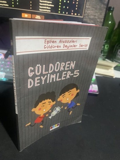 GÜLDÜREN DEYİMLER 5 - Eğiten Atasözleri Güldüren Deyimler Serisi - ZAFER İŞÇİ kitap kapağı